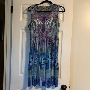 Beautiful colorful dress with plated cut outs and beautiful shear collar